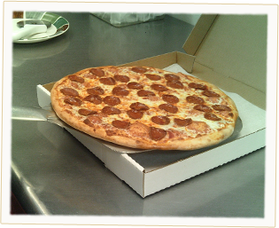 An Ameci's Pepperoni Pizza, fresh out of the oven and into the box.